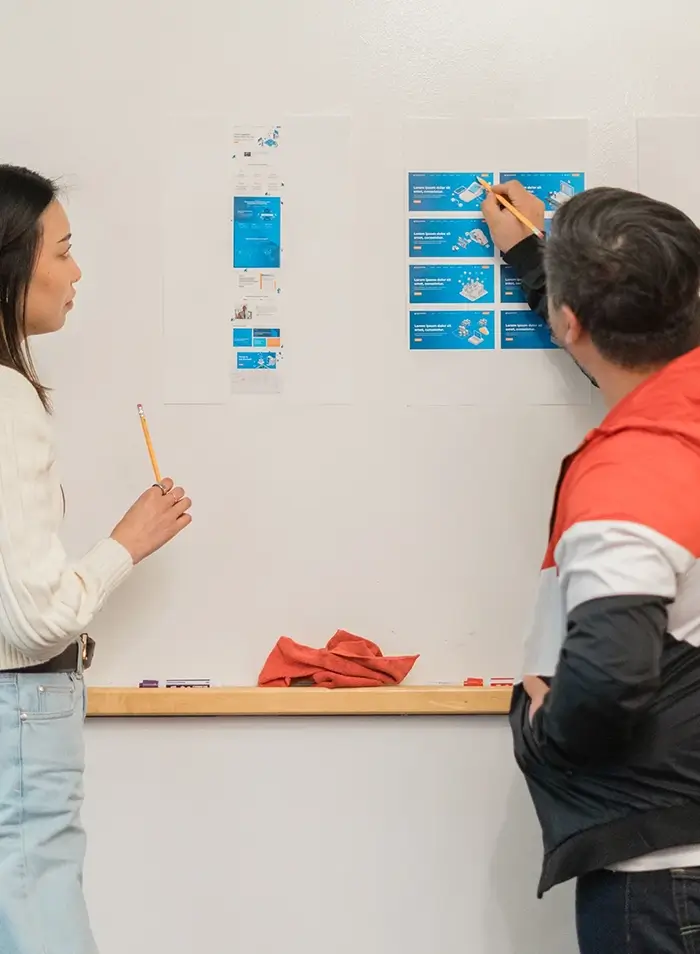 Two Clear Digital designers strategizing paid media campaigns to drive measurable results.